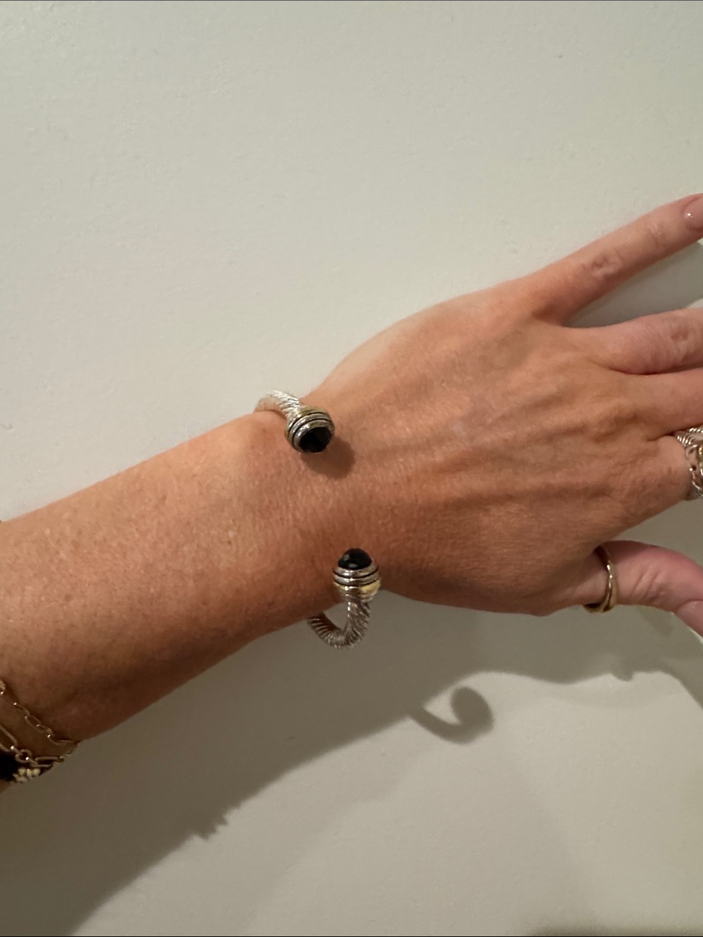 2 toned Open Cuff Bracelet with Black Stone Accents David y looking